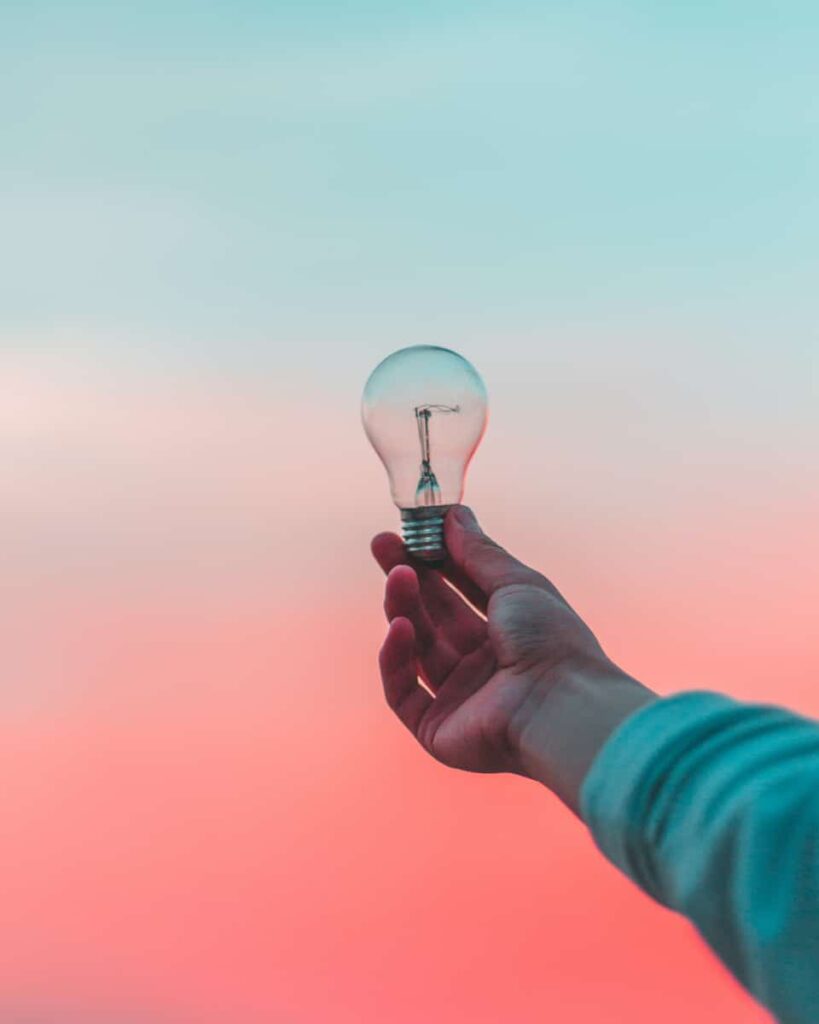 Person holding a lightbulb