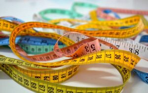 Different coloured tape measures